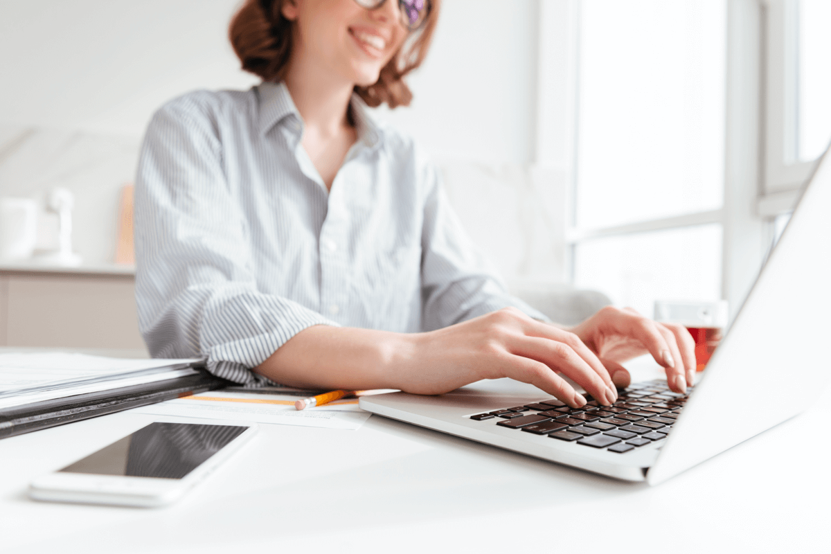 Woman typing on laptop computer